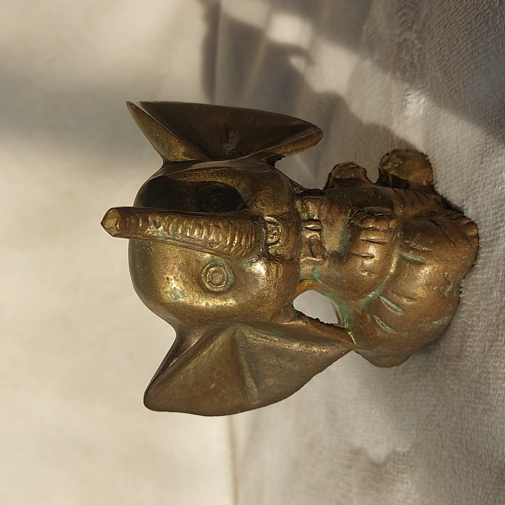 Vintage brass baby elephant figure with large dumbo ears